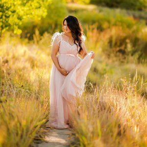 Light pink soft tulle maternity gown with feathers